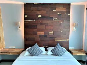Postel nebo postele na pokoji v ubytování Nan Panwa Hotel