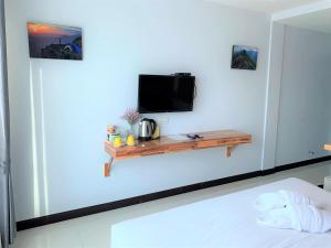 Postel nebo postele na pokoji v ubytování Nan Panwa Hotel