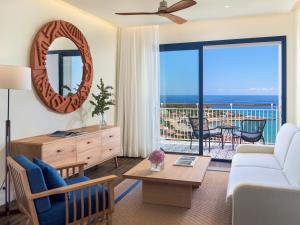 a living room with a view of the ocean at H10 Imperial Tarraco 4 Sup in Tarragona