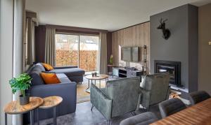 a living room with a couch and a table at Résidences Durbuy in Durbuy