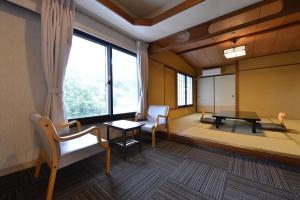 Postel nebo postele na pokoji v ubytování Ooedo Onsen Monogatari Hotel Suiyotei