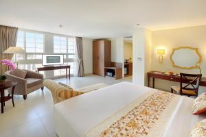 Postel nebo postele na pokoji v ubytování Kokoon Hotel Surabaya + 29 fotografií