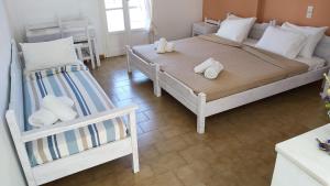 Ένα ή περισσότερα κρεβάτια σε δωμάτιο στο Giorgia Lodging