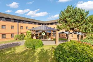 a building with a gazebo in front of it at Holiday Inn Leamington Spa - Warwick, an IHG Hotel in Leamington Spa