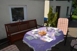 a purple table with a bowl of food on it at Ferienhaus Köhler in Marienberg