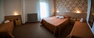Letto o letti in una camera di Hotel Rio