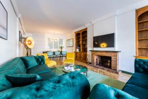 a living room with a couch and a fireplace at ZUBIETA PLAZA Apartment in San Sebastián