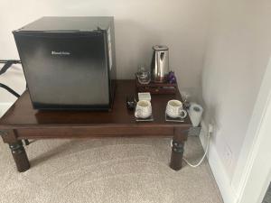 a television sitting on a table in a room at Rosebank in Spean Bridge