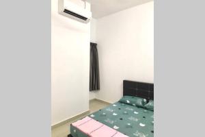 a small bedroom with a bed and a window at Familyday homestay Port Dickson BBQ 3min to beach in Port Dickson