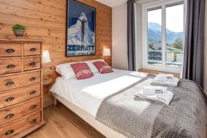 Postel nebo postele na pokoji v ubytování La Belle Epoque - Chamonix All Year