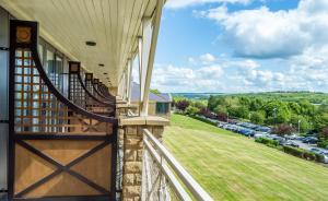 a balcony of a house with a view of a parking lot at Holiday Inn Leeds Brighouse, an IHG Hotel in Brighouse