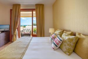 Ένα ή περισσότερα κρεβάτια σε δωμάτιο στο Conturana Residence