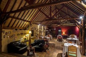 a large living room with leather couches and tables at Dolcemare Resort in Gili Air