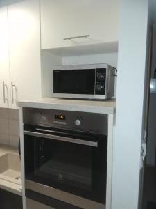Kuchyň nebo kuchyňský kout v ubytování Studio Apartment Lea