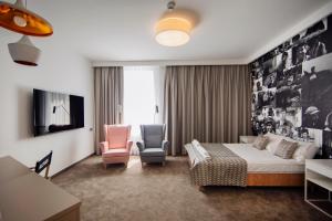 TV a/nebo společenská místnost v ubytování Hotel Jan Sander