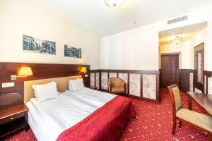 Postel nebo postele na pokoji v ubytování Rixwell Old Riga Palace Hotel