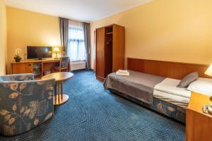 Postel nebo postele na pokoji v ubytování Hotel Fenix