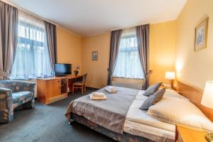 Postel nebo postele na pokoji v ubytování Hotel Fenix