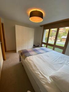 Postel nebo postele na pokoji v ubytování Luxury family apartment Engelberg
