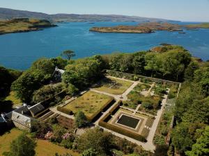 an aerial view of a garden near a body of water at Dunvegan Castle Rose Valley Cottage in Dunvegan