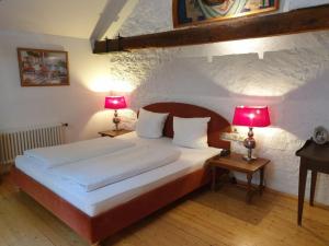 Postel nebo postele na pokoji v ubytování Hotel Altes Pfarrhaus Beaumarais