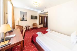 Postel nebo postele na pokoji v ubytování Rixwell Old Riga Palace Hotel