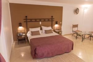 Llit o llits en una habitació de Airport Hotel Casino du Cap-vert