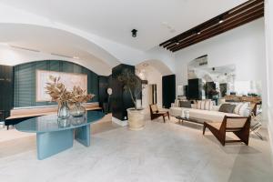 a living room with a couch and a table at Soho Boutique Colón in Málaga