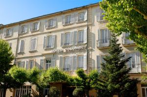 a building with the hotel colosseum on it at Hôtel Colombet in Nyons
