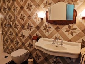 a bathroom with a sink and a toilet and a mirror at La Villa du Pré Du Cerf---------- TARIF PREFERENTIEL 2 NUITS------- in Spa +56 photos