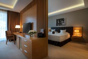 Łóżko lub łóżka w pokoju w obiekcie Tiffi Boutique Hotel