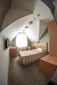 Ліжко або ліжка в номері Kolobok
