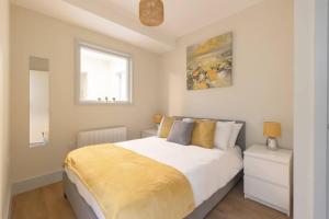 a bedroom with a large bed and a window at Apartment 3, Isabella House, Aparthotel, By RentMyHouse in Hereford