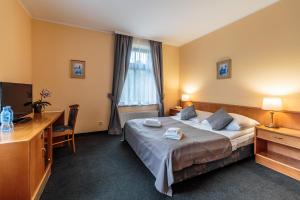 Postel nebo postele na pokoji v ubytování Hotel Fenix