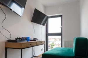 TV a/nebo společenská místnost v ubytování AMBER PORT
