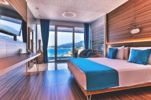 Postel nebo postele na pokoji v ubytování Carine Hotel Kumbor Superior