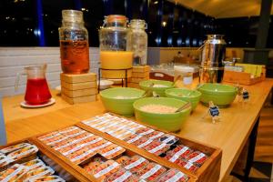 a table with a bunch of different types of food at Holiday Inn Warrington, an IHG Hotel in Warrington