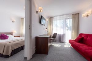 Posteľ alebo postele v izbe v ubytovaní Hotel Jan