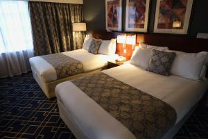 A bed or beds in a room at Crowne Plaza Liverpool - John Lennon Airport, an IHG Hotel
