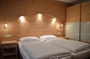 Postel nebo postele na pokoji v ubytování Chalet Regina