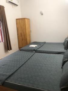 Postel nebo postele na pokoji v ubytování An Ngọc Linh Hotel