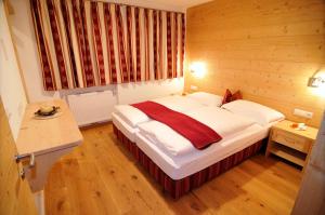 Postel nebo postele na pokoji v ubytování Chalet Regina