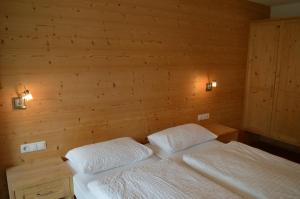 Postel nebo postele na pokoji v ubytování Chalet Regina