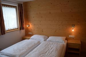 Postel nebo postele na pokoji v ubytování Chalet Regina