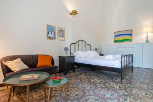 En eller flere senge i et værelse på Italianway - Le Cementine