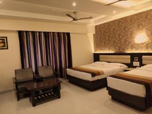 Voodi või voodid majutusasutuse Hotel Deepam toas