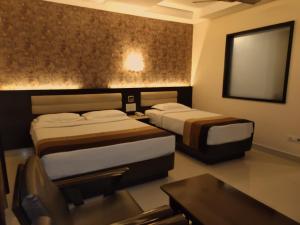 Voodi või voodid majutusasutuse Hotel Deepam toas