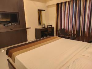 Voodi või voodid majutusasutuse Hotel Deepam toas