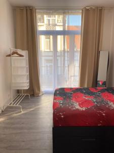 Giường trong phòng chung tại Dreamland Apartments EU, Brussels