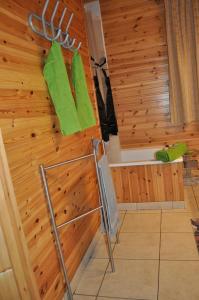 a sauna with green towels hanging on a wall at Les Rochettes - Vénus 1 in La Roche-en-Ardenne
